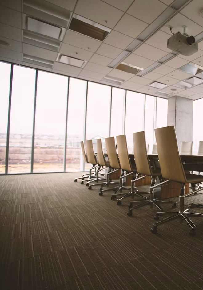A daylit boardroom overlooking the city